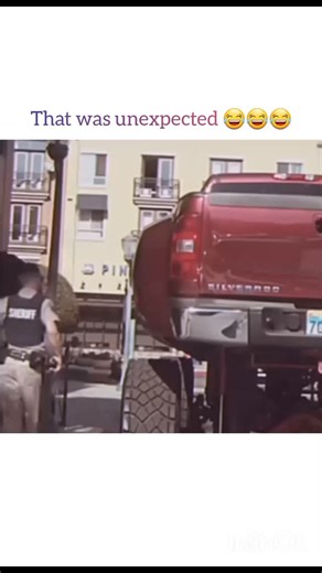 Koala on Instagram: "Follow mee?....The video opens with a Sheriff's deputy walking up to the side of a red Chevrolet Silverado pickup truck. However, this isn't a normal truck; it has been modified with a massive lift kit, making the body of the vehicle sit several feet higher than a standard truck. ​The Interaction ​The humor in the video comes from the physical height difference between the officer and the vehicle: ​The Request: The officer walks up to the towering truck and politely asks, "H
