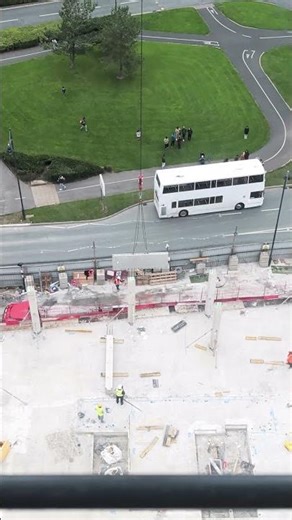 Crane in Action: Precast Wall Delivery at Construction Site
