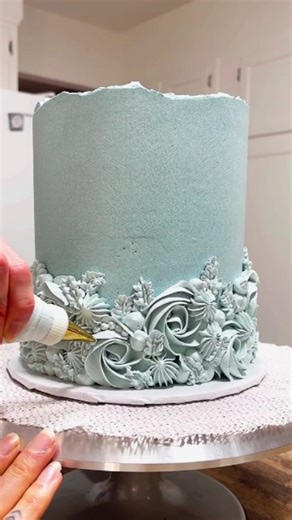 Frosted Homies on Instagram: "THE ART OF MONOCHROME: DUSTY BLUE TEXTURES 🦋✨ There is a quiet kind of magic that happens when you strip away the noise of multiple colors and focus entirely on texture. 🎨 For this design, I wanted to explore the balance between structure and flow. The tall, smooth sides provide a calm canvas, leading up to that raw, torn top edge—imperfectly perfect and rustic. But the real story is happening at the base. 👇 By using a single shade of dusty sage-blue, every movem