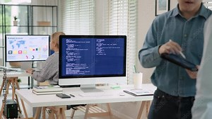 Smart AI cyber bot deep tech tools help write prompt code screen. Asia people asian man IT team typing busy talking work on predict big data center office reskill upskill STEM expert skill job course.