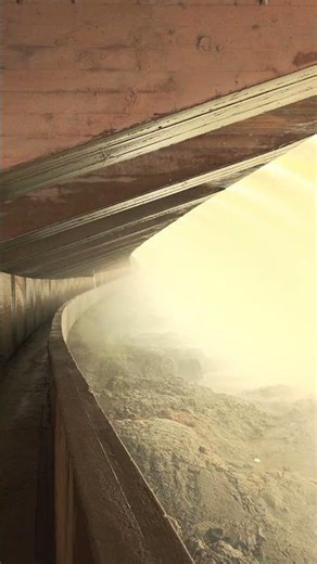 Walking behind a waterfall at Horseshoe Dam.