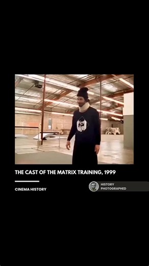 The cast of the 1999 film The Matrix underwent an intense, multi-month training regimen focused on various kung fu styles and wirework techniques to prepare for their groundbreaking action sequences. This rigorous preparation, documented in various behind-the-scenes footage, was essential for convincingly executing the complex fight choreography envisioned by the directors. Credit: Warner Bros. Entertainment | History In Pictures