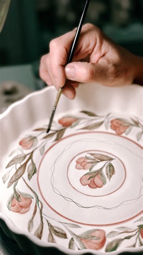 Love in Pottery on Instagram: "Isabella & María (@ceramicababushka) are a mother–daughter ceramic duo based in Argentina, shaping clay into soulful pottery where art, care, and daily ritual meet. Their ceramics honor slow craft, warm details, and pieces made to be used—yet still felt. Isabella & María showcase how they prep and paint with pure pigments—Ruby, Coral, and Chrome Green from DP Colors. They mix pigment with water into airy, translucent washes, then brush stems, leaves, and florals ac