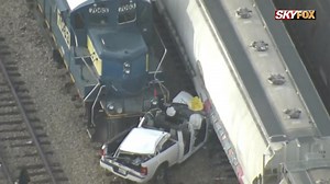 Driver loses control, crashes into freight train in Orlando, police say