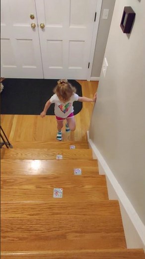 Stair navigation: Ascending reciprocally (one foot per step) with sticker cues