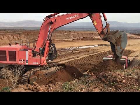 Hitachi Zaxis 670 Excavator Loading Trucks With Three Passes