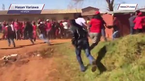 WATCH: News24 intern Hasan Variawa hit, falls to the ground in Tembisa, Johannesburg. A group of men armed with sjamboks, knobkerries, pointed sticks and golf clubs have attacked EFF members and the media during a visit to Sethokga Hostel. READ MORE: http://www.news24.com/SouthAfrica/News/live-tshwane-protests-20160621 | News24.com