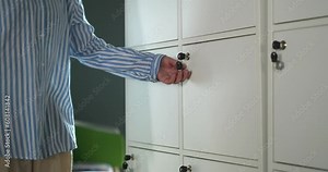 Close up of post office boxes with keys in door lock. Row of private metal containers in a post office. 4k. High quality 4k footage