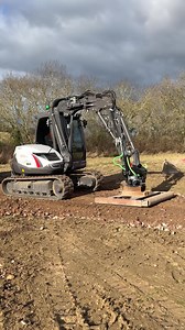 Specialised Groundcare's Mecalac with grade beam putting in a track to a stable complex | RPA Media