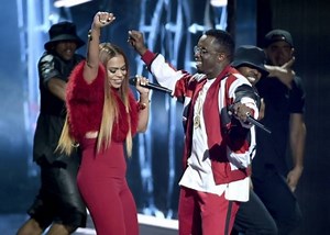 Rapper P Diddy falls into a hole on stage as he performs at BET Awards 2015