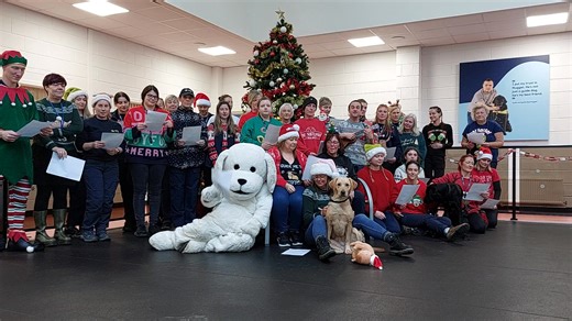 “My loyal partner by my side, the best gift of the year!” 🎁🦮 Enjoy this festive singalong from staff at Guide Dogs Scotland’s Forfar centre, with some lovely lyrics from Academy GDMS Rob Bousie! Is it too late for a Christmas number one? 🎶 [Video shows staff in festive clothing, alongside trainee guide dogs and our Guide Dogs mascot, singing in front of a large Christmas tree at the Forfar Regional Centre.] | Guide Dogs Scotland