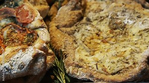 Lebanese style big flat bread baked and seasoning with different topping looks like pizza Stock Video