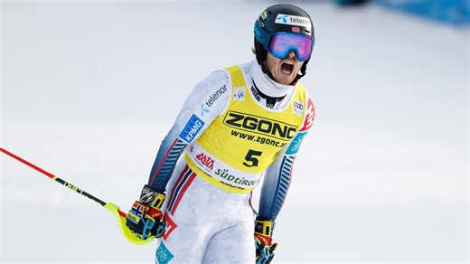 Norway's Atle Lie McGrath stands atop the mountain in Alta Badia