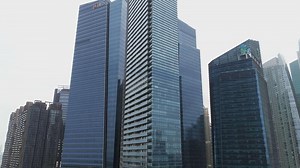 Download SINGAPORE, JUNE 2018. Aerial footage of Singapore skyscrapers with City Skyline during cloudy summer day. Shot. Singapore New city buildings Skyscrapers Aerial view