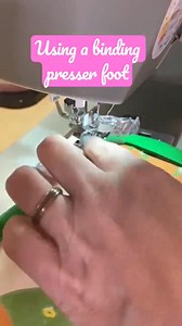 Using a binding/bias tape presser foot https://quiltingcrafthub.com/products/bias-tape-binding-presser-foot #handkerchief #handkerchiefhemmer #handkerchiefhemmingfoot #sewinggadgets #hemmingfoot #sewingtools #sewingtutorial #sewistsofinstagram #sewinghacks #diysewing #tailoringtools #narrowhems #sewingessentials #professionalfinish #sewingcommunity #delicatefabrics #fashionsewing #sewinglove #sewingtips #sewingprojects #craftingtools #sewinginspiration #sewingmadeeasy #precisionsewing | Quilt Pa