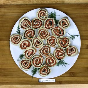 If you are a lover of smoked salmon these Easy Smoked Salmon Tortilla Roll-ups have to be on your bucket list. Words just cant explain how good these are. Really. I make these because they are so easy and can be prepared ahead of time if I am having company. They look beautiful on an appetizer tray and I am always asked for the recipe. Every time. I have never had any leftovers! Ever! https://kitchendivas.com/smoked-salmon-tortilla-roll-up/ | Kitchen Divas