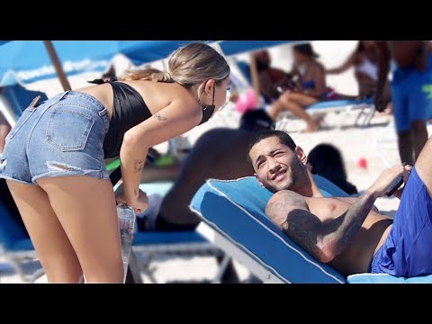 Staring At Strangers On The Beach..