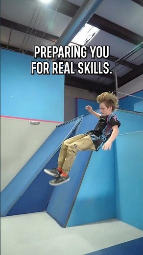 learning parkour with landing mats and pads at Freedom in Motion parkour gym.