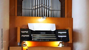 Ornate pipe organ filling a grand church with music. Towering pipes creating a majestic backdrop in a church. Intricate design of a colossal church pipe organ. Impressive pipe organ commanding attenti Stock Video