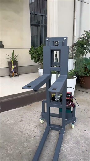 A compact forklift with adjustable-width forks. Maneuverable, portable, and handles 300kg with ease.