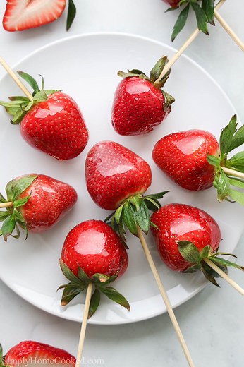 This Strawberry Tanghulu has a sweet crunchy shell on the outside and ripe strawberries on the inside. It's easy to make and perfect for a summer treat. RECIPE- https://simplyhomecooked.com/tanghulu-recipe/ | Simply Home Cooked