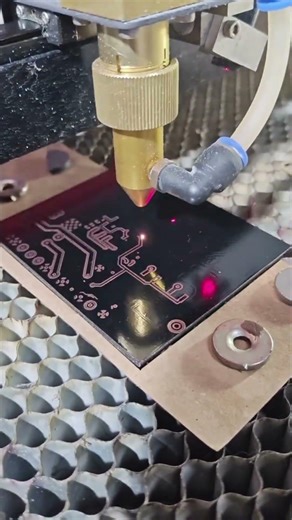 Creating a PCB prototype using a CO2 laser.