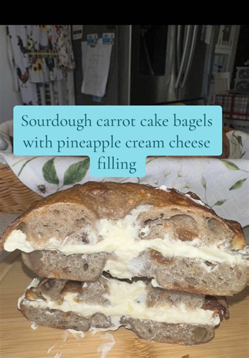 Sourdough carrot cake bagels with pineapple cream cheese filling. Ingredients: - 200g starter - 310g water - 600g bread flour - 50g brown sugar - 12g salt - 1 teaspoon cinnamon - 1/2 teaspoons nutmeg Mix in’s - 50g grated carrot - 50g walnuts - 50g sultanas or raisins Mix first 7 ingredients till shaggy dough and let sit for 39 mins. Then knead for 8-10 minutes. Adding in the carrots and chopped walnuts about halfway through. Then add the sultanas in the last minute of kneading. Transfer to a co