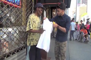 Two guys make homeless people smile.