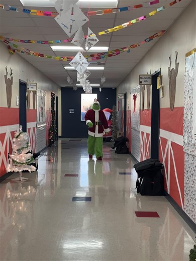 💚🎄 Special Visitor Alert! 🎄💚 The Grinch made a surprise visit to our campus today and brought lots of laughs, smiles, and holiday cheer with him! Students and staff loved the chance to see this sneaky holiday visitor roaming the halls and spreading festive fun. It was a great reminder that even the Grinch can’t resist the joy of our school community! | Trinity Basin Preparatory - South