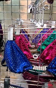 An in-store view of our wall of bling💎💎💎 See samples of #CompetitionBikinis from beginner to pro, we got you covered! #SYCompetitionsuits #SwarovskiCrystals #CompetitionSuits | Suits You Competition Suits