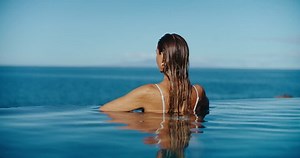 Woman Relaxing Luxury Infinity Pool Looking Stock Footage Video (100% Royalty-free) 1099180717 | Shutterstock