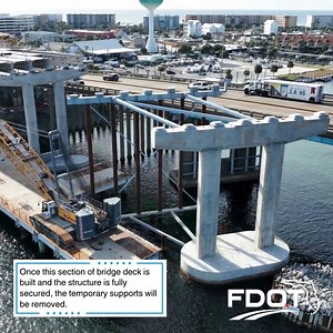 Here is a look at the temporary stability support system, located on the east side of the main channel piers for the new Brooks Bridge westbound structure. These temporary structures are constructed to aid the installation of the center span beams, or girders, for the new bridge. The support system is comprised of large vertical pipe piles and steel cross-bracing (the grey triangular structure at the waterline) connected to the pier footer and cap. Next, crews will set the first sections of the 