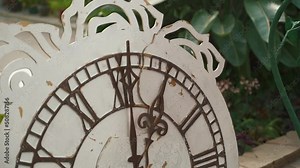 Old Retro Wall Clock with Moving Second Hand. Vintage clock with a white circular dial. Close-up. Old-fashioned antique clock. Arrow clock with second, minute, and hour hand. Time concept.