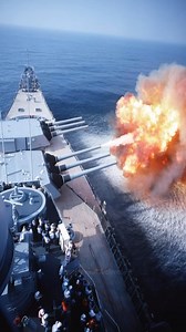 USS Wisconsin fires her massive 16"/50 Mark 7 naval guns during a live-fire exercise prior to decommissioning, captured on 28 May 1991, as towering muzzle blasts erupt from the forward turrets and shockwaves ripple across the surrounding sea, showcasing the raw power of one of the last operational Iowa-class battleships an iconic moment documented by the United States Department of Defense that marks the closing chapter of battleship-era naval firepower. 🕊⚓🇺🇸 | History Vault Archives