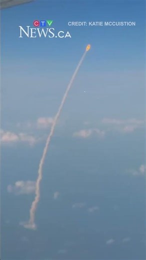 Passengers watch Artemis II launch from the sky