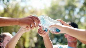 Volunteers, hands and bottles with unity, nature and environmental care for cleanup. NGO, team and support for sustainable, recycling and green collaboration for charity service or earth day project