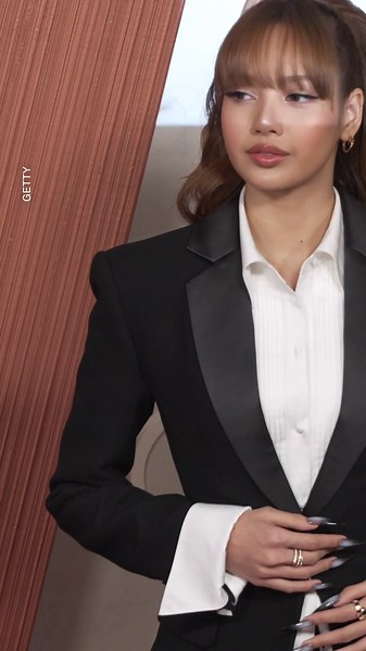 ‘White Lotus’ star Lisa suits up on red carpet before her performance at Oscars 2025