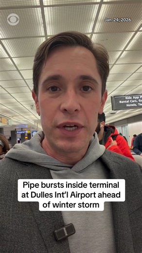A pipe burst inside a terminal at Washington Dulles International Airport on Saturday ahead of this weekend's storm. Airlines have canceled thousands of flights and are preparing crews to restart operations on Monday once the storm passes. | CBS News
