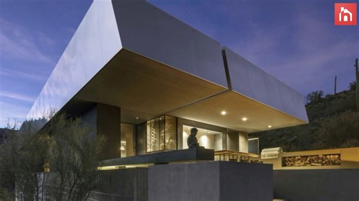 Contemporary house with a unique floor plan and a huge roof canopy