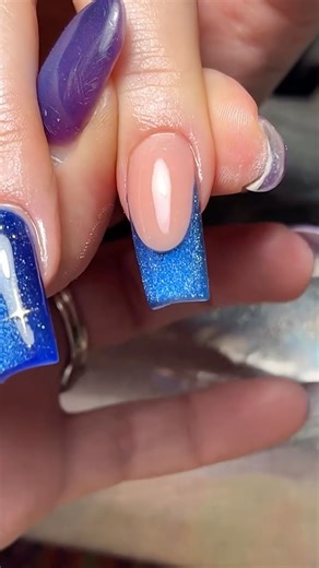 Kerri Anderson 💅🏼 on Instagram: "Quick clip of cat eye gel encapsulated under acrylic 💅🏼✨ Midnight sky blue doing absolute bits 🌌👀 If you wanna learn crispy French smile lines, cleaner application, proper blending, structured sets, statement designs, seasonal stuff… the lot, it’s all inside my 16-class online masterclass bundle. Acrylic skills, French, blends, 3D, geometrics, rainbows, opals, Christmas chaos… everything I teach, in one place 💥 All on private YouTube links, easy to watch, 