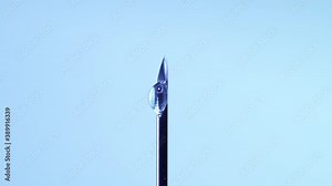 Medical vaccine dripping from the syringe needle. Concept of lab developing research of vaccine against Coronavirus, COVID-19. Pre-clinical evaluation and clinical phase trials development test