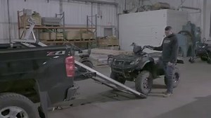 The DGRP Ramp is simple to use and will have your snowmobile, ATV, lawn mower or golf cart up and loaded in seconds. Simply drive up and onto the ramp and easily pick up and push the ramp into the back of the truck bed. This high-grade aluminum ramp sits on 6-inch caster wheel rollers with super-pro2 slider allows you to easily slide the ramp back and forth, whether loaded or empty. | DGRP inc.