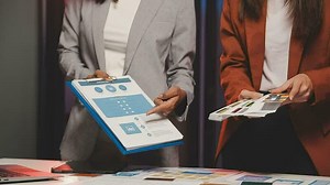 UX designer planning phone app development template layout wireframe design at modern office.