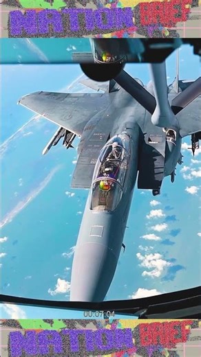 U.S. KC-135 Stratotanker boom operator refuels F-15E Strike Eagles