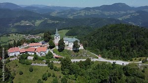 A drone view of an old church located on a hill. The camera moves smoothly to the left. Zasavje Holy Mountain, The Mary’s Nativity Church.