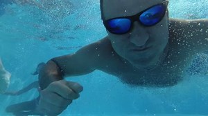 clip-32672983-happy-man-dive-under-water-pool-looking