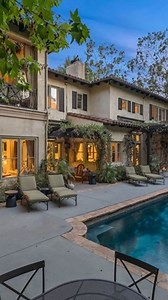 . Privacy, elegance and quality set behind the guarded gates of The Summit in Beverly Hills. The former celebrity Mediterranean Villa sprawls 7,453sf of immaculate architecture and design. Style and sophistication is realized as the front door opens to the grand entry with soaring ceilings and stone floors. High class accommodations throughout including 6 bedrooms, 7 bathrooms, a large family room, living room, chefs kitchen, theatre, office and a separate maids quarter. Each downstairs room ope