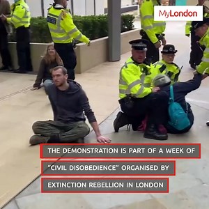 Extinction Rebellion protestors glued themselves to the floor outside of an oil company's headquarters in London | MyLondon