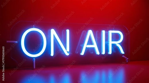 Bright blue on air neon sign turning on and off with a flickering effect. The glowing sign is placed on a shiny surface with a vibrant red background