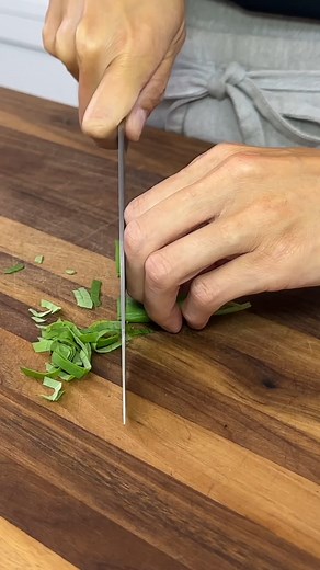 Step up your culinary game with the art of basil cutting! Your dishes are about to get a whole lot more vibrant and delicious! https://www.jessicagavin.com/how-to-cut-basil/ | Jessica Gavin